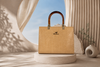 Camel Croc-Texture Handbag on Minimalist Luxury Podium Background